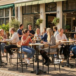 Super-Seat | Praag (terras) barkrukken vlechtwerk met arm | Gevlochten stoelen & barkrukken van riet met met met metalen frame, houten tafels buiten bij restaurant. | Horecameubilair